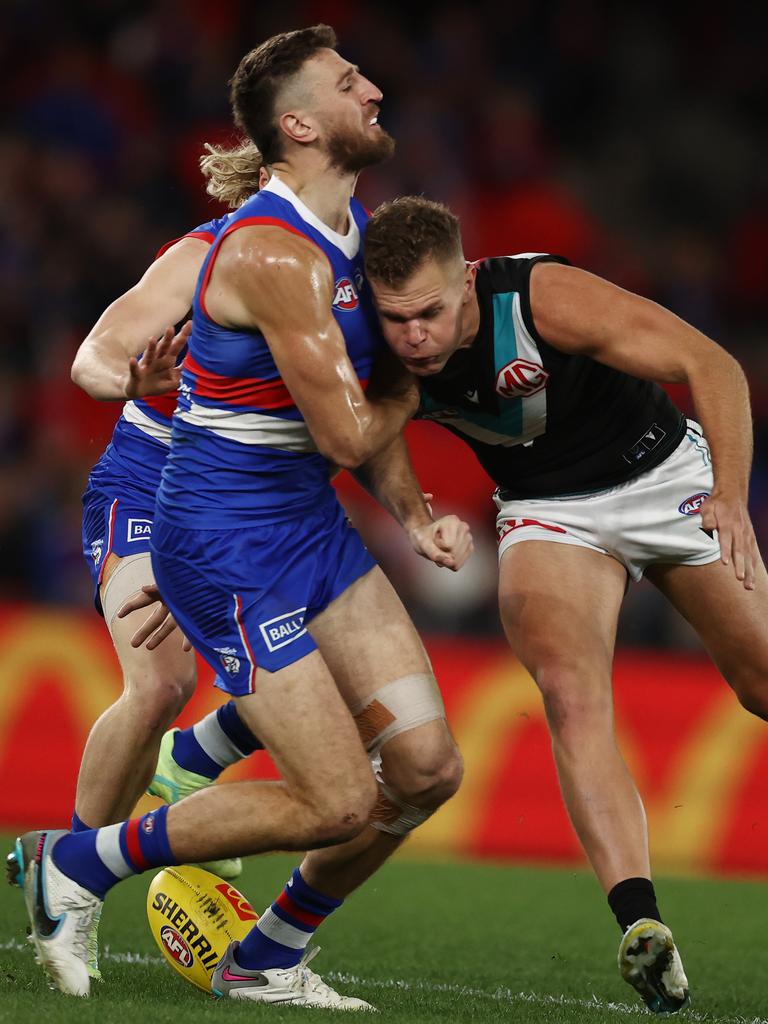 Marcus Bontempelli collides with Dan Houston on Friday night. Picture: Michael Klein