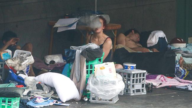 Homeless people camped in Flinders Street next to Flinders Street Station. Picture: Ian Currie