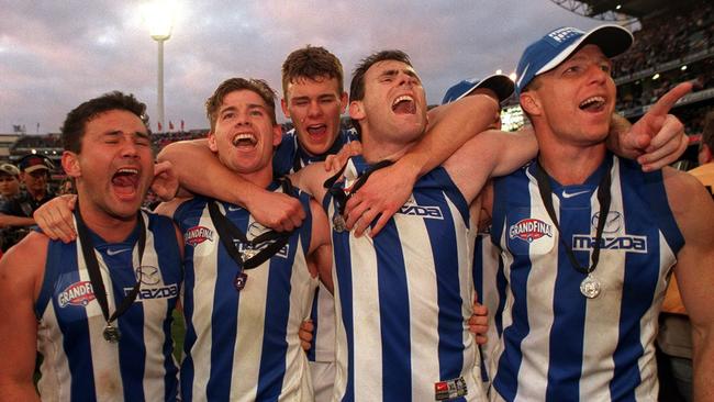 Peter Bell (from left), Shannon Grant, Cameron Mooney, David King and John Blakey after North Melbourne’s 1999 Grand Final win.