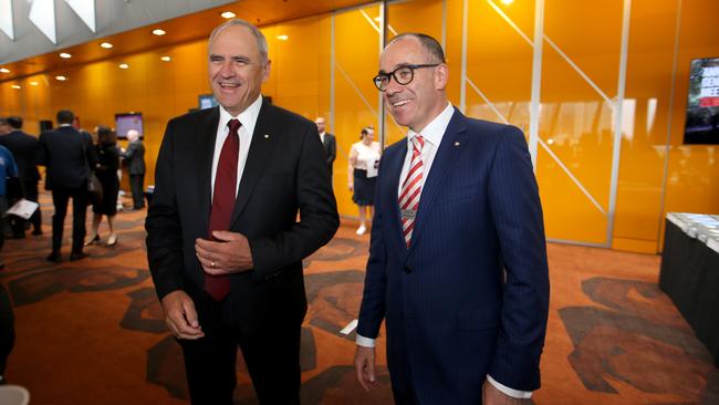 NAB Chairman Ken Henry and CEO Andrew Thorburn chat with shareholders before the AGM at Melbourne Convention Centre. Picture: David Geraghty