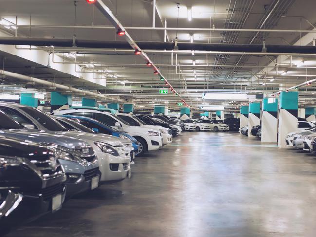 Underground carpark generic .Cars parked in the parking lot.Open space area indoors.