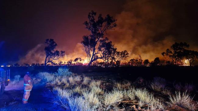 Bushfires NT crews and volunteers worked to backburn a fire in Alice Springs on Sunday. Picture: Supplied