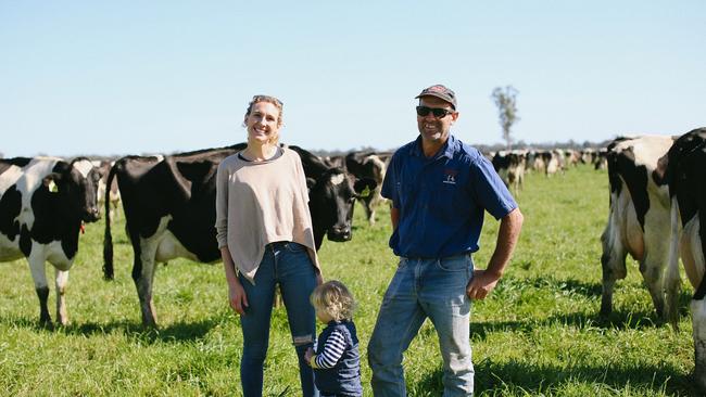 Emma Elliott with son Xavier and her father Steve Chesworth on their family owned and run Little Big Dairy farm. Picture: Sophie Hansen