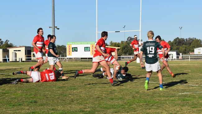 Spectators cheer on as they watch the B Grade St George vs Condamine match at the Roma Rugby Races at Bassett Park. Picture: Chloe Cufflin.