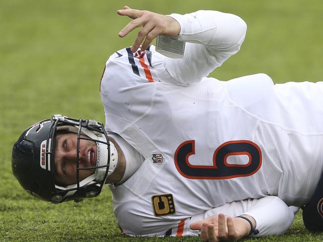 FILE - In this Nov. 20, 2016 file photo, Chicago Bears quarterback Jay Cutler (6) reacts after getting knocked down by the New York Giants during the first quarter of an NFL football game in East Rutherford, N.J. Cutler will have season-ending surgery on his right shoulder. Coach John Fox announced Thursday, Dec. 1, that the veteran quarterback will have an operation to repair the labrum in his shoulder. (AP Photo/Seth Wenig, File)