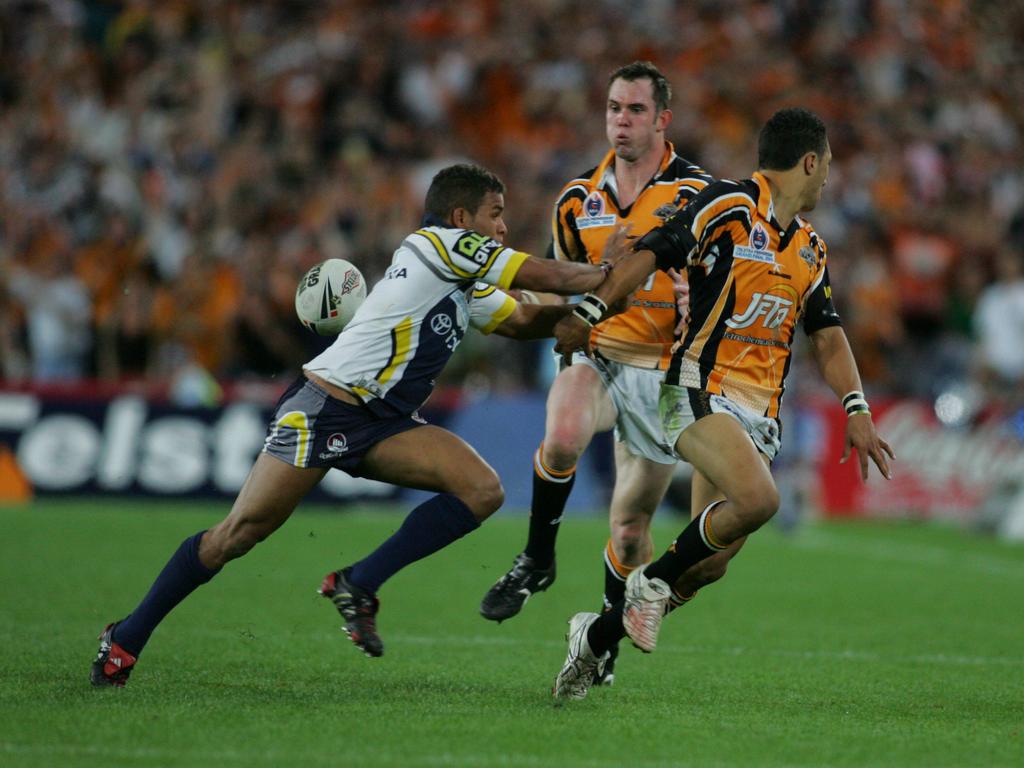 Tigers winger Pat Richards (middle) takes flick pass from Benji Marshall to score a try in the 2005 grand final against the Cowboys.