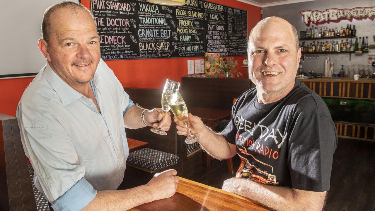 Owners Richard May-Steers (left) and Alan Wynn from Toowoomba's favourite hamburger shop Phatburgers celebrate the store's 15th birthday. Sunday, September 18, 2022. Picture: Nev Madsen.