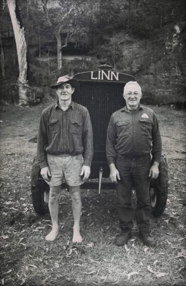 Eric and John Scott, the current owners of Scott's Farm, in front of one of their tractors. Picture: Supplied