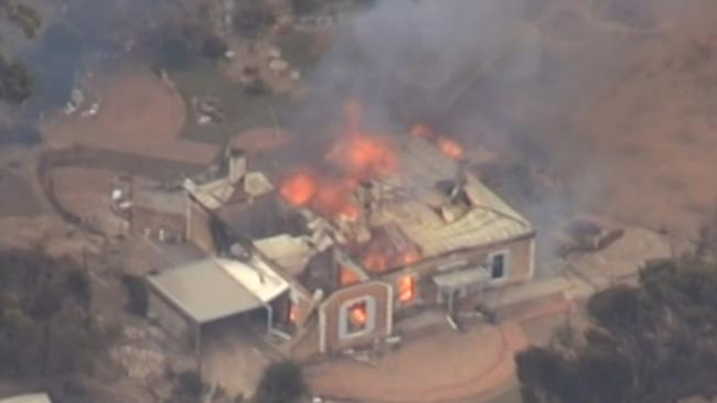 Properties burning near Wasleys after the Pinery Fire took hold . MUST CREDIT : Nine News .