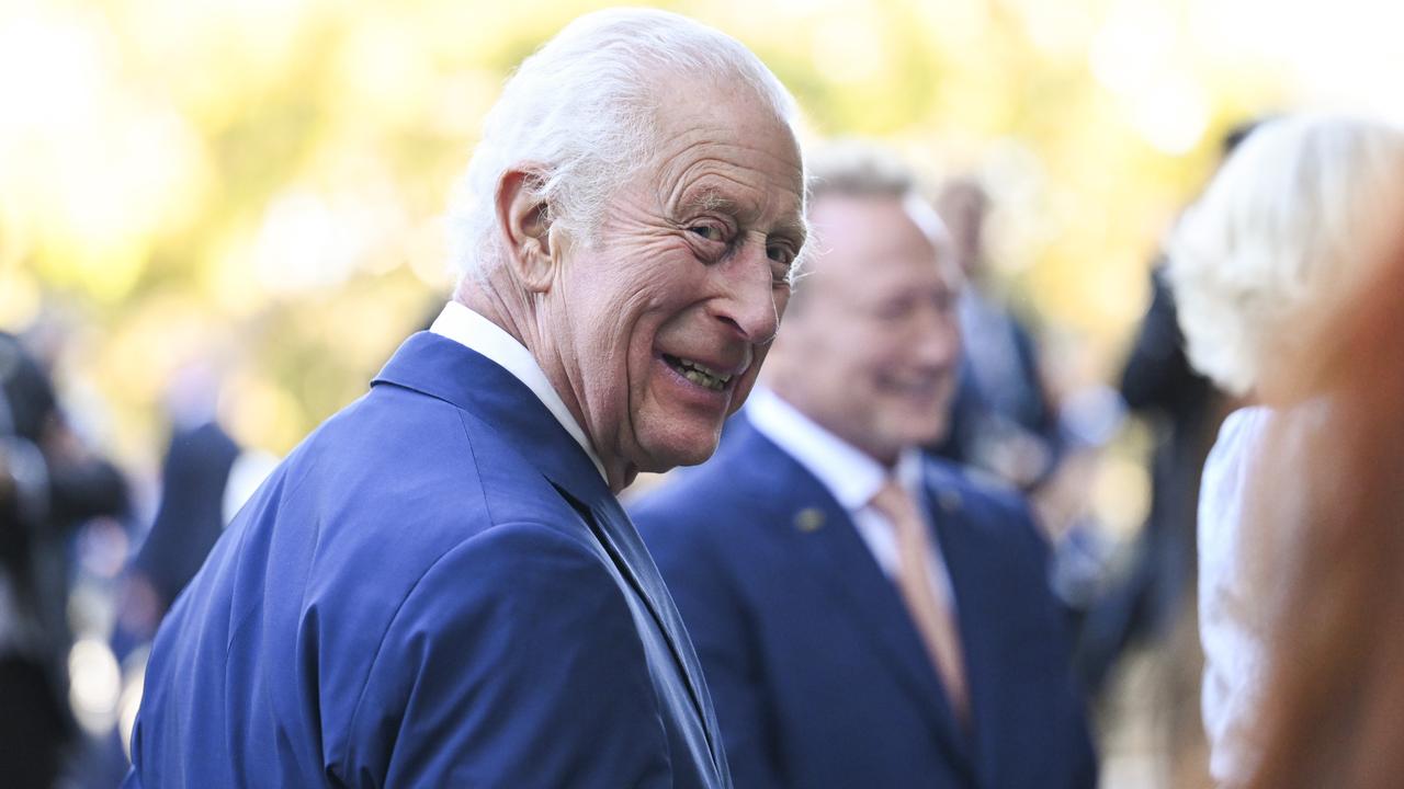 King Charles III flashes a cheeky smile as visits Canberra on Monday. Picture: NewsWire / Martin Ollman