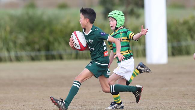 Randwick U10 player Louie Vereker on the burst.