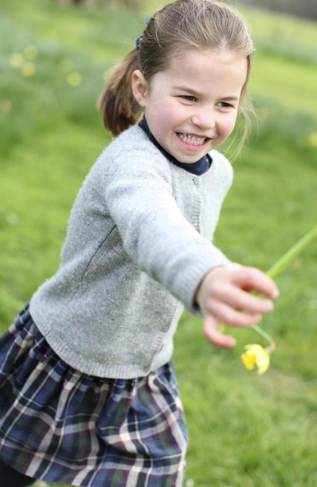 The young princess is seen happily running around the gardens. Picture: Duchess of Cambridge/Kensington Palace via AP