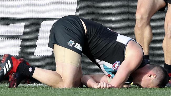 Port Adelaide’s Tom Rockliff down with a shoulder injury. Picture: SARAH REED