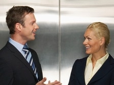 RendezView. Happy business colleagues communicating in elevator. (Pic: Supplied)