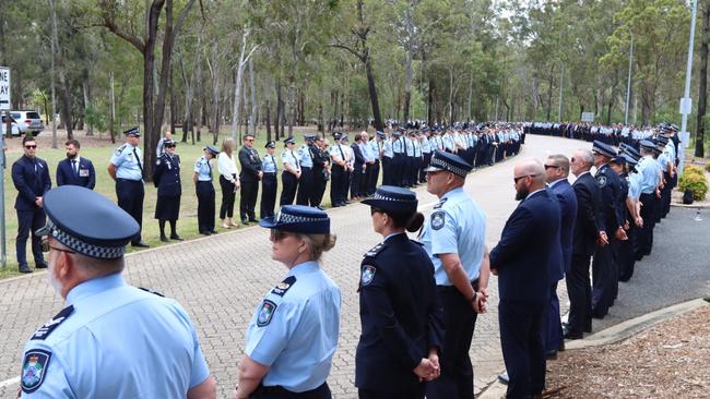 Queensland police officers form a guard of honour after the service at the Brisbane Entertainment Centre. Picture: David Clark