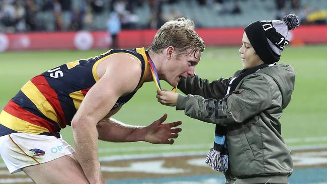 Crows defender Alex Keath accepts the Showdown Medal as the best-afield in the derby win against Port Adelaide at Adelaide Oval on Saturday night. Picture: Sarah Reed