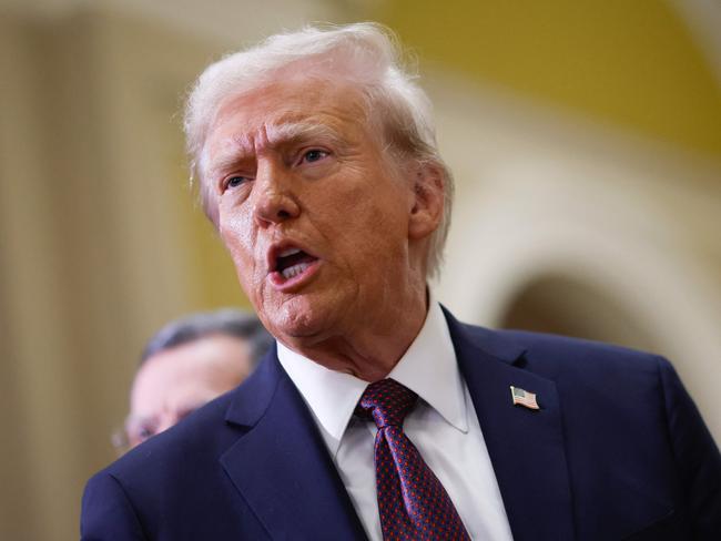 US President-elect Donald Trump speaks to the press after paying his respects in front of the flag-draped casket at the Lying in State Ceremony for former President Jimmy Carter at the US Capitol Rotunda in Washington, DC on January 8, 2025. Carter, the 39th President of the United States, died at the age of 100 on December 29, 2024 at his home in Plains, Georgia. (Photo by Ting Shen / AFP)