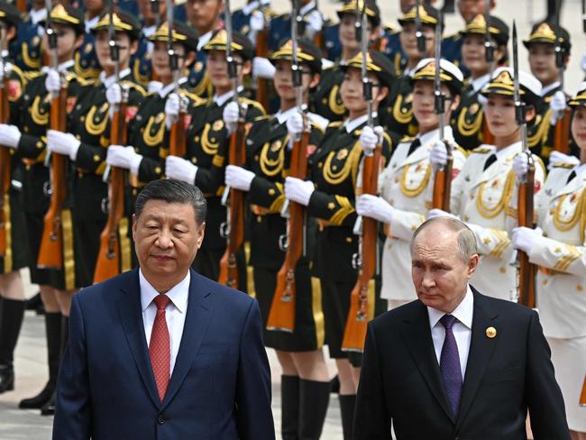 TOPSHOT - In this pool photograph distributed by the Russian state agency Sputnik, Russia's President Vladimir Putin and China's President Xi Jinping attend an official welcoming ceremony in front of the Great Hall of the People in Tiananmen Square in Beijing on May 16, 2024. (Photo by Sergei BOBYLYOV / POOL / AFP) / ** Editor's note : this image is distributed by Russian state owned agency Sputnik **