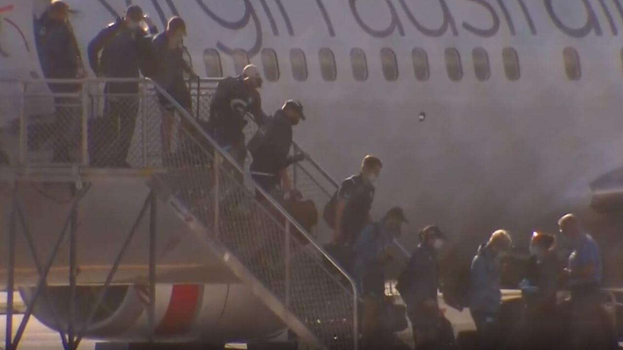 Geelong staff and players were escorted by police to their quarantine hotels upon touching down in Perth on Wednesday.