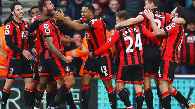 AFC Bournemouth players celebrate a goal against Liverpool.