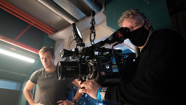 Luke Bracey as Alexander and cinematographer Ross Emery on the set of Interceptor. Picture: Netflix