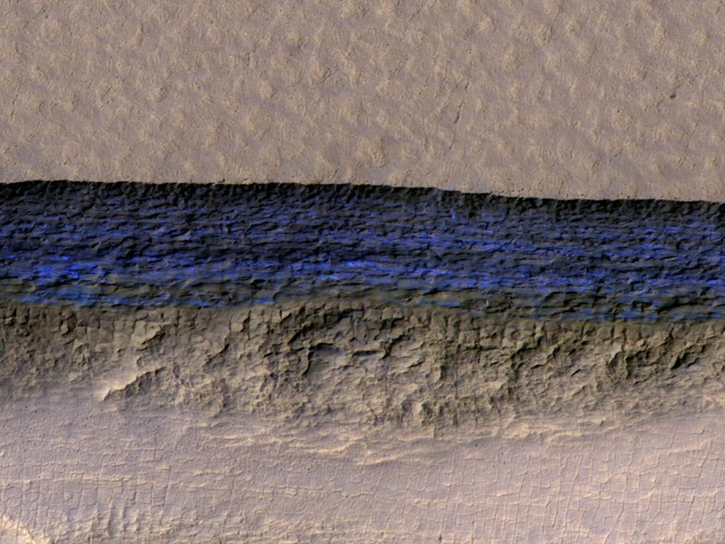 A colour-enhanced view of a scarp on Mars. The deep blue colour shows the location of underground deposits of water ice. Picture: NASA/JPL-Caltech/UA/USGS