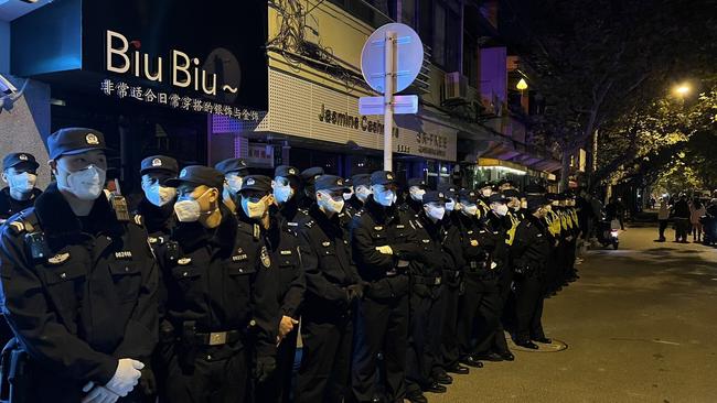 Crowds were met with a heavy police presence in Shanghai.