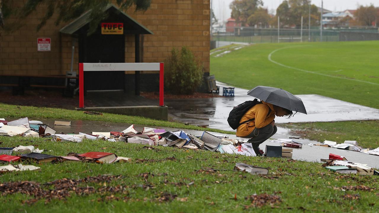 A student looks at books that flowed out of the Law library at UTAS in Sandy Bay. Picture: SAM ROSEWARNE