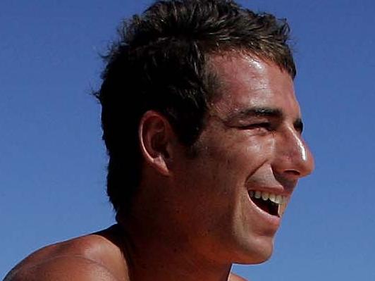 Melbourne footballer Phil Read checks out the surf at Tweed Heads before heading out. Phillip Read.