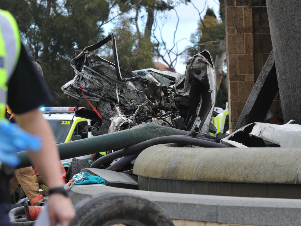 Emergency service workers at the crash on the corner of Glen Osmond and Cross roads. Picture: Roger Wyman