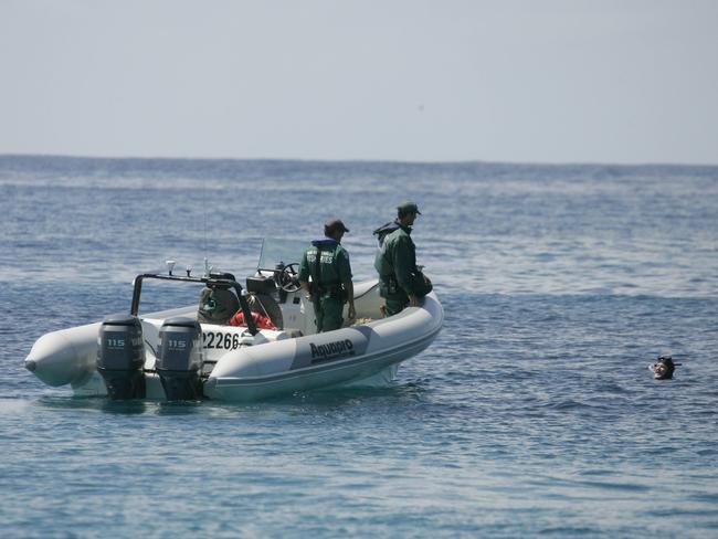 Fisheries officers off the coast near Batemans Bay check out a person snorkelling.