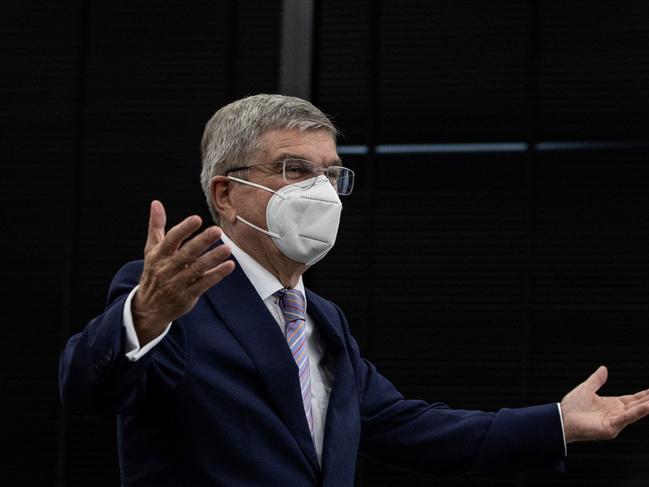 International Olympic Committee (IOC) president Thomas Bach gestures as he arrives at a meeting with Tokyo 2020 president Seiko Hashimoto (not pictured) at the Tokyo 2020 headquarters in Tokyo on July 13, 2021. (Photo by Takashi Aoyama / POOL / AFP)