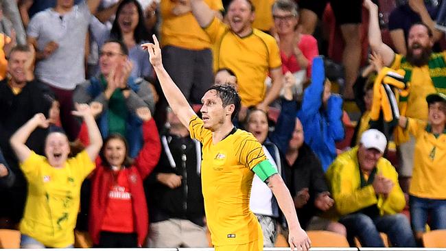 Graham Arnold would love for Mark Milligan to stay on with the Socceroos.