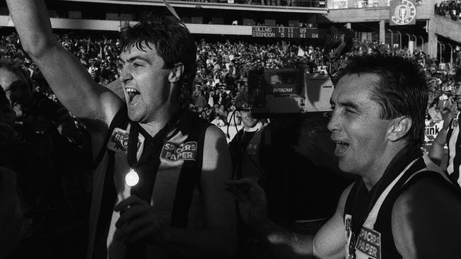 Mick McGuane celebrates the Magpies’ 1990 triumph with skipper Tony Shaw.