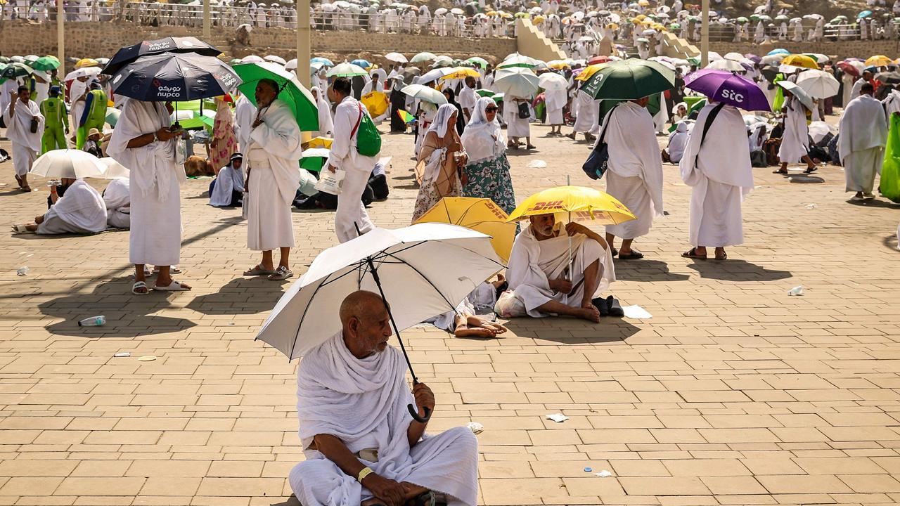 Muslim pilgrims use umbrellas to shade themselves from the sun. Picture: Fadel Senna/ AFP