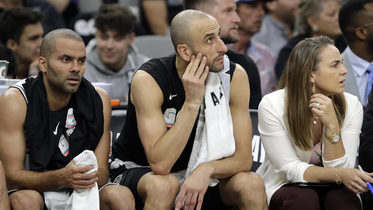 San Antonio Spurs' Tony Parker, left, Manu Ginobili and assistant coach Becky Hammon.