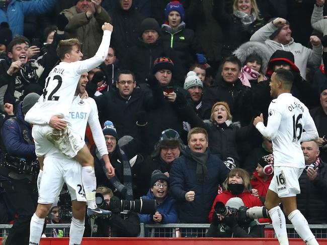 Gylfi Sigurdsson of Swansea City (L) celebrates scoring his side’s third.