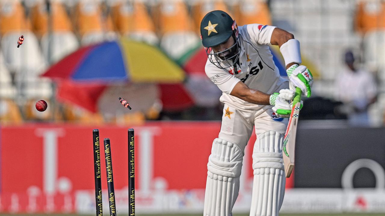 Pakistan's Mohammad Rizwan is clean bowled by England's Brydon Carse. (Photo by Aamir QURESHI / AFP)