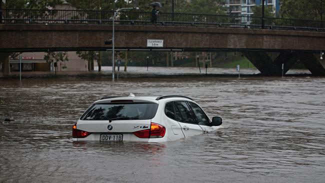 he car stuck in the Parramatta River on Sunday afternoon. Picture: Adam Yip