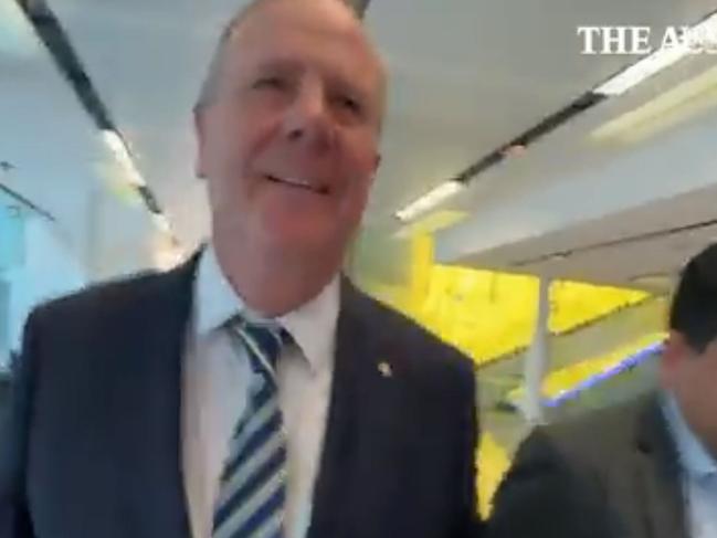 Nine chair Peter Costello has been captured on camera knocking a journalist to the ground during a scuffle at Canberra Airport. Picture: The Australian