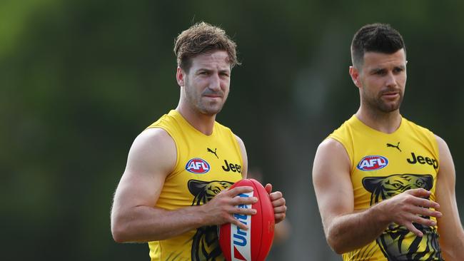 GOLD COAST, AUSTRALIA - JANUARY 30: Kane Lambert and Trent Cotchin during a Richmond Tigers AFL training session at Southport Sharks on January 30, 2020 in Gold Coast, Australia. (Photo by Chris Hyde/Getty Images)