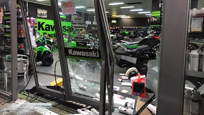 Thieves used a stolen red LandCruiser to ram raid the store and steal a motorbike.