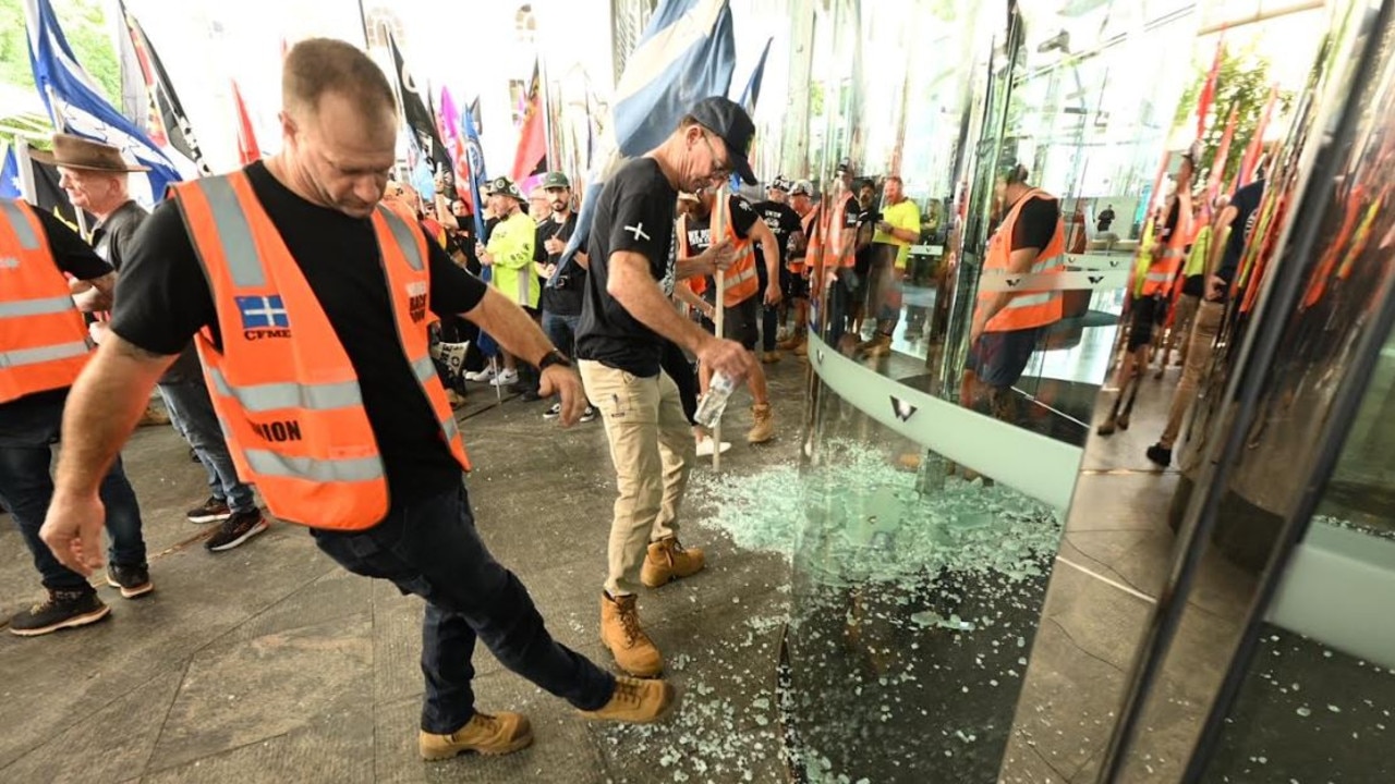 A glass door was smashed and profanities written on windows at Waterfront Place during a union protest. Picture: Lyndon Mechielsen