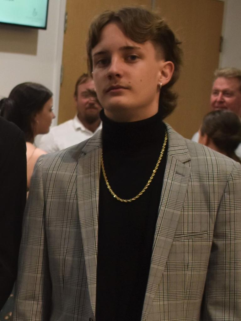 Reece Ardrey took a leaf out of the 1980s playbook with this great mullet and turtleneck combo at the 2021 Nambour State College formal. Picture: Eddie Franklin