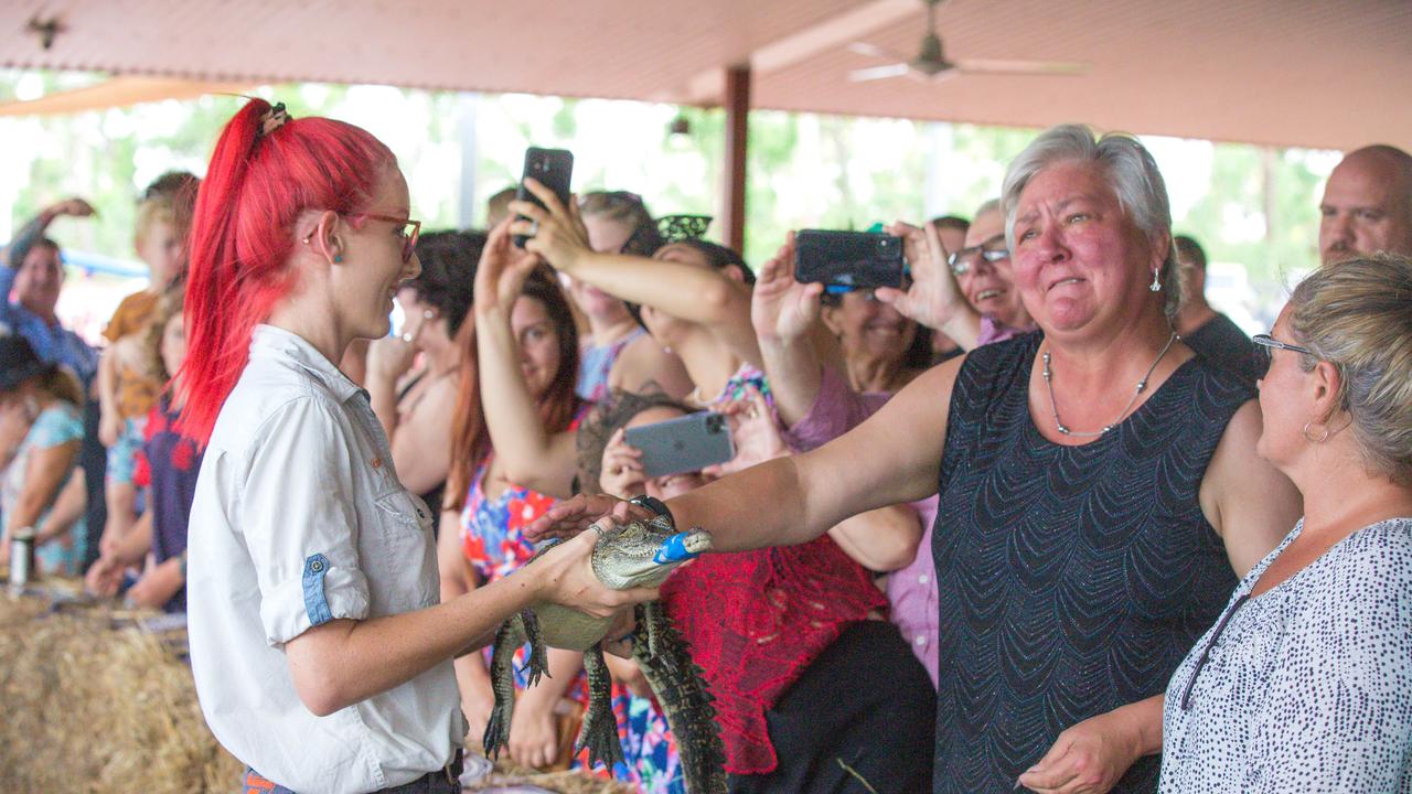 Croc racing at the Berry Springs Tavern for Melbourne Cup Day: Senator Sam McMahon meets a competing croc. Picture: GLENN CAMPBELL