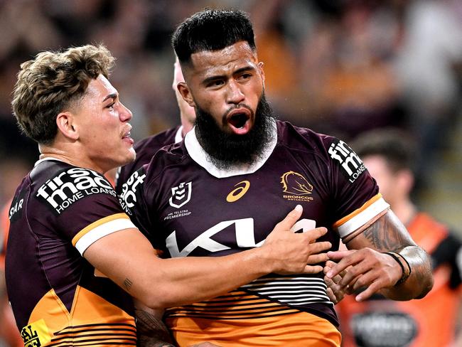 BRISBANE, AUSTRALIA - APRIL 01: Payne Haas of the Broncos celebrates with team mate Reece Walsh of the Broncos after scoring a try during the round five NRL match between Brisbane Broncos and Wests Tigers at Suncorp Stadium on April 01, 2023 in Brisbane, Australia. (Photo by Bradley Kanaris/Getty Images)