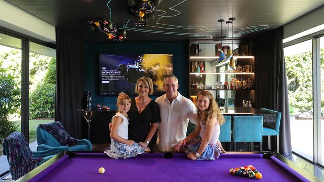 V8 Supercar driver Paul Weel and his wife Emma, with daughters Mila 8 and Abby 10, are selling their main river home at Carrara, which they built from scratch. Picture Glenn Hampson