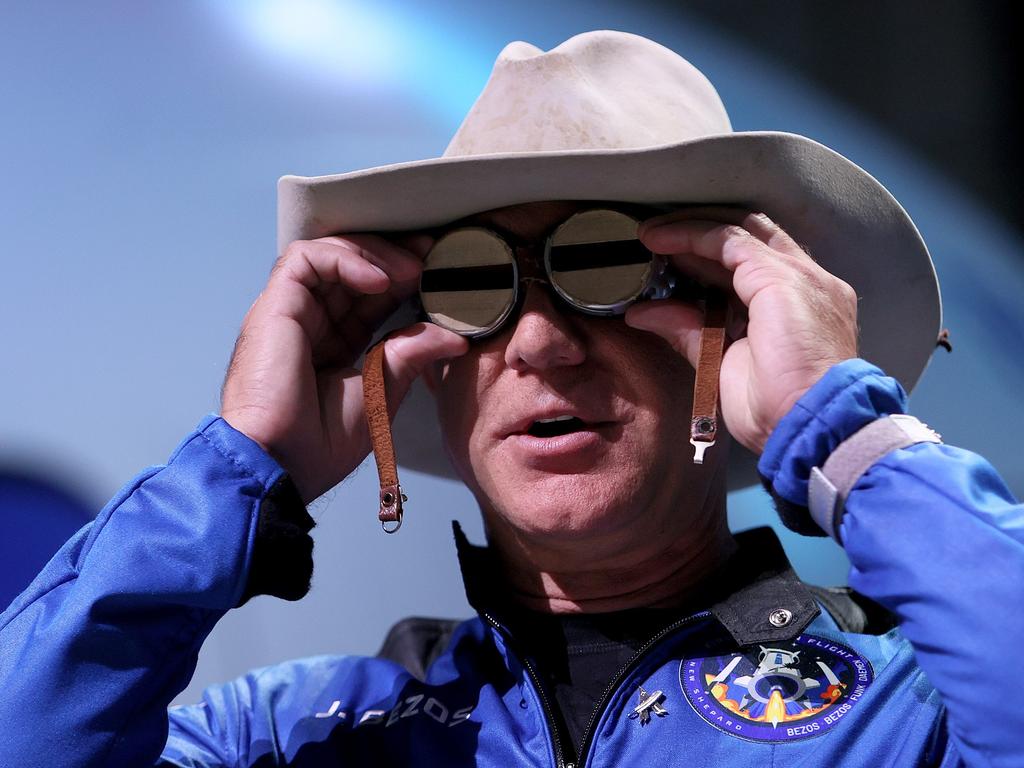 Jeff Bezos holds the aviation glasses that belonged to Amelia Earhart as he speaks during a press conference about his flight. Picture: Joe Raedle/Getty Images/AFP