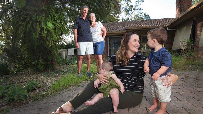 Kate Carmody says goodbye to her children Olive and Abel and leaves them in hands of her parents Neil Thorogood and Ruth Lund as she moves to Brisbane to join her husband in the fight against the coronavirus. Picture Glenn Hampson