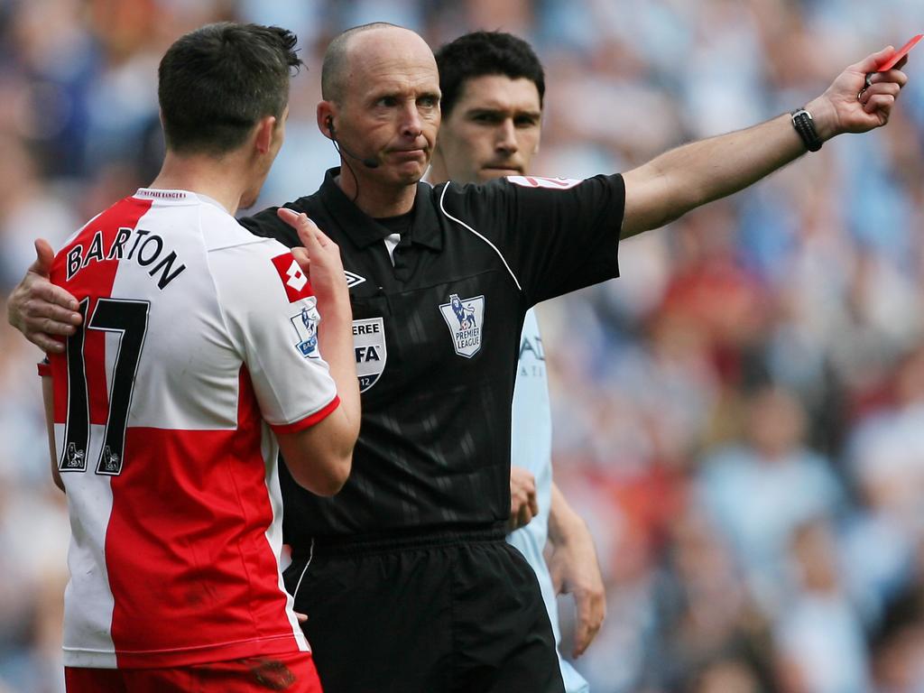 Referee Mike Dean shows Joey Barton a red card and sends him off against Manchester City, on the most dramatic of Premier League final days. Picture: AMA/Corbis via Getty Images